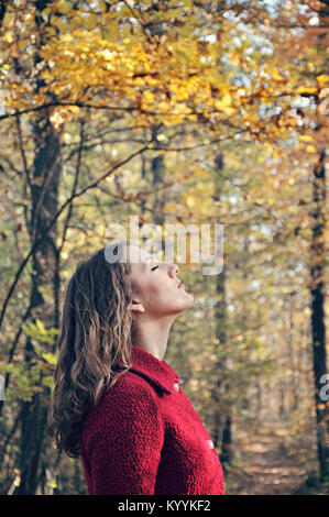 Outdoor portrait of young adult woman with eyes closed Stock Photo