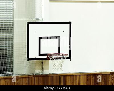 Basketball hoop and billboard sport in the school gym. Empty gym after training Stock Photo