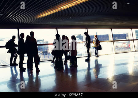 group of people in an airport Stock Photo