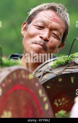 A Shaman singing and drumming in Gosainkunda, Kavre, Nepal. Stock Photo