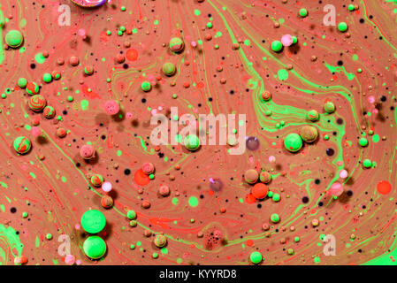 Toxic chemical acrylic oil droplets on water creating the idea of pollution concepts ideas and themes in bright vibrant colours, as the circle globule Stock Photo