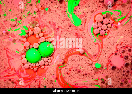 Toxic chemical acrylic oil droplets on water creating the idea of pollution concepts ideas and themes in bright vibrant colours, as the circle globule Stock Photo