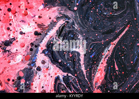 Toxic chemical acrylic oil droplets on water creating the idea of pollution concepts ideas and themes in bright vibrant colours, as the circle globule Stock Photo