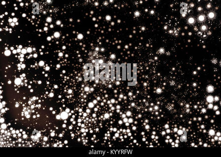 Air bubbles trapped in water in silhouette landscape form using macro close up capturing the fizzy bright bursting circles and drops of air in the bla Stock Photo