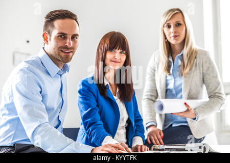 Portrait of young fashion designers working together in office Stock Photo