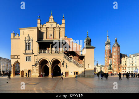 Krakow, Lesser Poland / Poland - 2017/03/28: Cracow Old Town, Cloth Hall, St. Mary cathedral and medieval tenements by Main Market Square Stock Photo