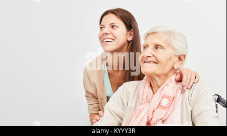 Young woman and senior woman are smiling and hopeful looking to the future Stock Photo
