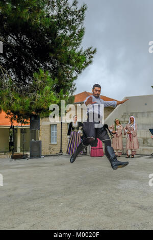 Arsos Village, Cyprus - October 8, 2017: Man dressed in traditional clothing performing folk dance, zebekiko, at a festival. Stock Photo
