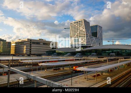 The Jaarbeurs, City Hall, Utrecht Centraal railway station with platforms and railways during sunset. Utrecht, The Netherlands Stock Photo