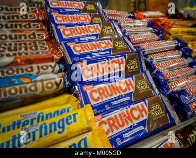 A selection of NestlÃ© brand candies among other brands on the shelves of a store in New York on Tuesday, January 16, 2018. Italian chocolatier and candy manufacturer Ferrero (and maker of the wildly popular Nutella) is buying NestlÃ©'s U.S. confectionary business for approximately $2.8 billion. Ferrero will now become the third-largest candy maker in the U.S. behind The Hershey Co. and Mars. (Â© Richard B. Levine) Stock Photo
