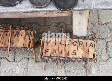 Wooden African log xylophone with sticks for sale, Mosi-Oa-Tunya, Victoria Falls, Zimbabwe. Stock Photo