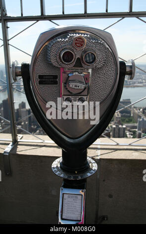 Coin operated tower viewing telescope binoculars designed by Tower Optical Comany inc. on The Empire State Building, New York State, USA Stock Photo