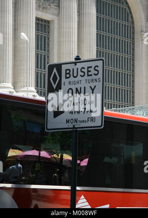 Bus stop with bus operating hours outside Grand Central Terminal, New York City, New York State, USA. Stock Photo