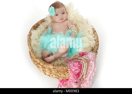 11 week old baby girl in basket with soft blanket Stock Photo