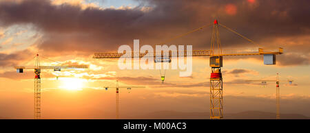 Construction site. Tower cranes on cloudy sky at sunset or sunrise background. 3d illustration Stock Photo