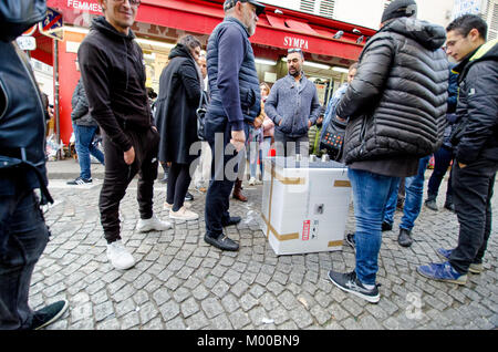 Paris, France. Man in Montmartre doing the 'cup and ball' trick or 'shell game' Stock Photo