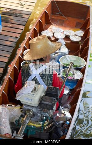 vendor on boat at the Taling Chan floating market, Bangkok, Thailand Stock Photo