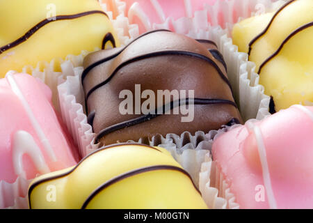 Fondant fancies cakes also known as French fancies. Stock Photo