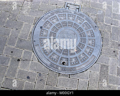 Santo Domingo, officially Santo Domingo de Guzmán, is the capital of the Dominican Republic. Caribbean Zona Colonial - man hole cover Stock Photo