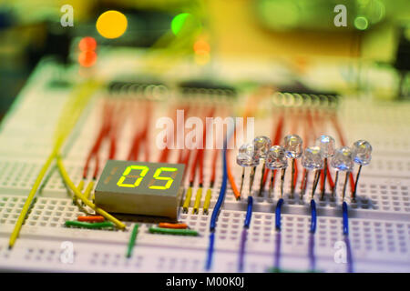 Me prototyping voltage and current indicating system for my DIY car battery charger on microcontroller. Stock Photo