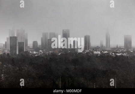 Frankfurt am Main, Germany. 17th Jan, 2018. Heavy wind drives snow above the highrise buildings of Frankfurt am Main, Germany, 17 January 2018. Credit: Frank Rumpenhorst/dpa/Alamy Live News Stock Photo