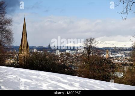 Glasgow, Scotland, UK. 17th January, 2018. View over Glasgow from a snowy Queen's Park looking west towards University of Glasgow and snow-capped hills. Credit: Tony Clerkson/Alamy Live News Stock Photo