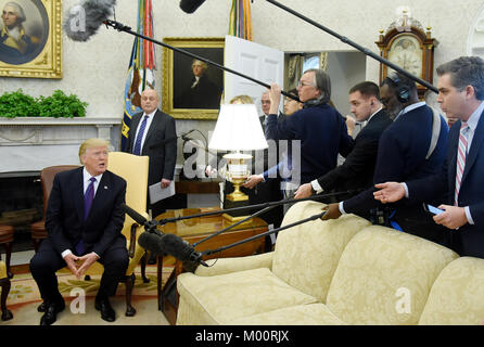 Washington, District of Columbia, USA. 16th Jan, 2018. United States President Donald J. Trump answers questions from the media, as he meets with President Nazarbayev of Kazakhstan in the Oval Office of the White House. Credit: Olivier Douliery/CNP/ZUMA Wire/Alamy Live News Stock Photo