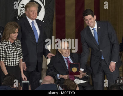 Washington, USA. 17th Jan, 2018. Speaker of the United States House Paul Ryan (Republican of Wisconsin) presents the Congressional Gold Medal to former US Senator Bob Dole (Republican of Kansas) in the Rotunda of the US Capitol on Wednesday, January 17, 2017. Congress commissioned gold medals as its highest expression of national appreciation for distinguished achievements and contributions. Credit: ZUMA Press, Inc./Alamy Live News Stock Photo