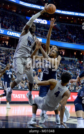 Washington, DC, USA. 17th Jan, 2018. 2018017 - Villanova guard MIKAL BRIDGES (25) commits a charging foul against Georgetown guard JAGAN MOSELY (4), as Georgetown center JESSIE GOVAN (15) blocks his shot attempt, in the first half at Capital One Arena in Washington. Credit: Chuck Myers/ZUMA Wire/Alamy Live News Stock Photo