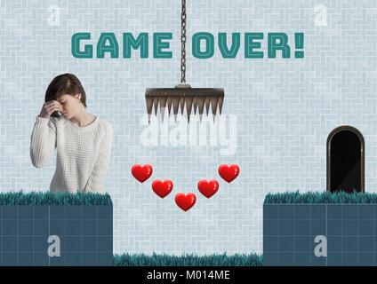 Game over text and woman in Computer Game Level with hearts and traps Stock Photo