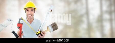 Construction Worker on building site with tools Stock Photo