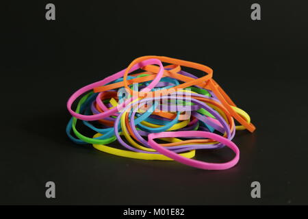 Rubber band colors dark background Stock Photo