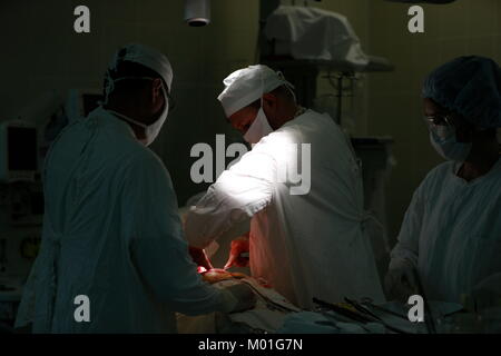 City Gomel Belarus 01june 2017. Gomel medical hospital.Doctors in the operating room in masks during the operation.Team of surgeons at work.Operating Stock Photo