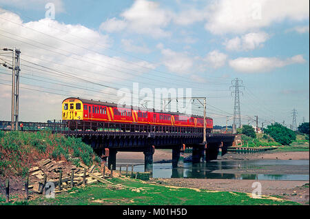 Class 302 mail unit number 302990 heads south along the Great Eastern main line at Manningtree. 15th June 1993. Stock Photo