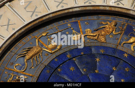 Ancient time and Astrology. Detail of Saint Mark Square renaissance Clock Tower in Venice with zodiac signs Scorpio, Libra Virgo, planet and stars (15 Stock Photo