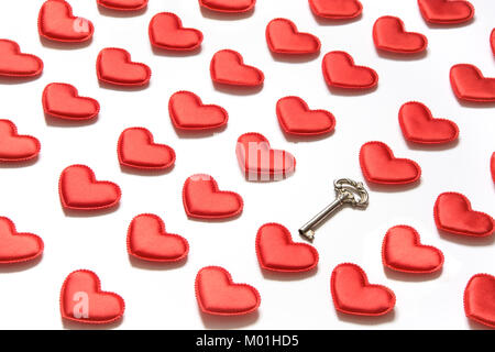 Pattern made of red hearts and key on white background. Heart in isometric style. Valentine's card. May be use for wrapping paper. Stock Photo