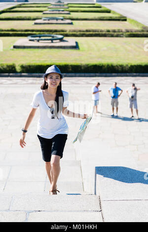 Happy Asian woman during summer vacations Stock Photo