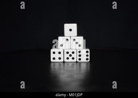 Dices on black background with reflection Stock Photo