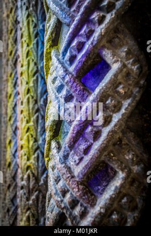 Colorful old column closeup, St. Stephen's Cathedral, Vienna, Austria. Detail of Romanesque carved stone columns, church entrance. Stock Photo