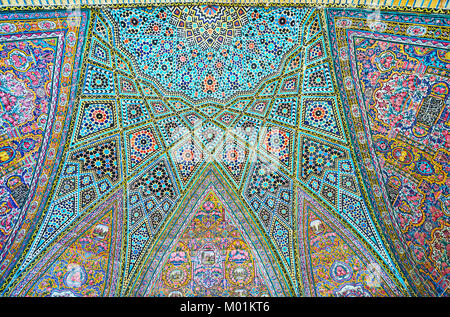 SHIRAZ, IRAN - OCTOBER 12, 2017: The tiled ornaments of the semi-dome in Nasir Ol-Molk mosque include stellar, floral and geometric details, on Octobe Stock Photo