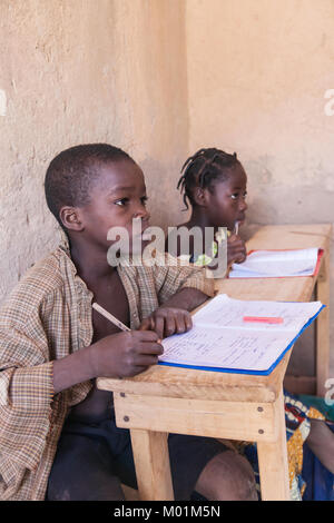 Two african schoolkids focused on the lesson during class, Ouagadougou, Burkina Faso. Stock Photo