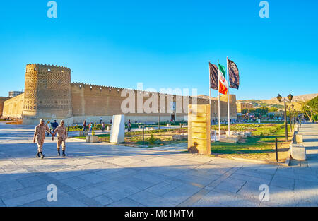 SHIRAZ, IRAN - OCTOBER 12, 2017: Karim Khan Arg (citadel) is well preserved medieval brick fortress with tilted towers, covered with relief patterns,  Stock Photo