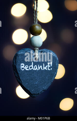 Stone heart with blurry light bokeh background Stock Photo