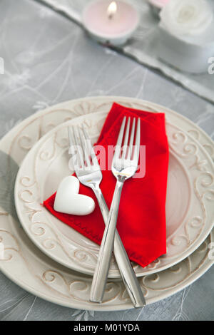 Table setting (two forks) for Valentine\'s Day with red hearts on ... Table setting (two forks) for Valentine\'s Day with red hearts on ...