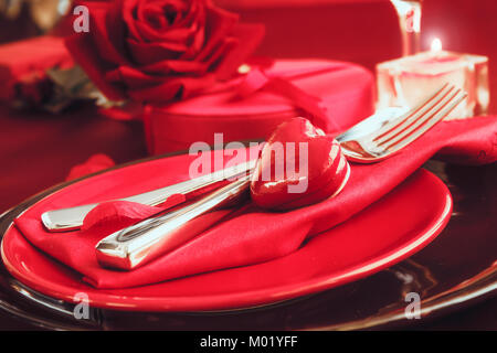St. Vsalentines day dinner. Valentines daytable setting in rustic elegant style with cutlery. Romantic dinner Stock Photo