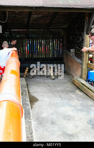 THANNENKIRCH, FRANCE - JULY 11, 2010: people look on skittles game at traditional fair in Thannenkirch village in summer. Thannenkirch is commune in r Stock Photo