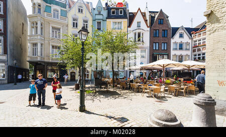 AACHEN, GERMANY - JUNE 27, 2010: tourists on Munsterplatz square near Aachen Cathedral in summer. The Dom is one of the oldest cathedrals in Europe, i Stock Photo