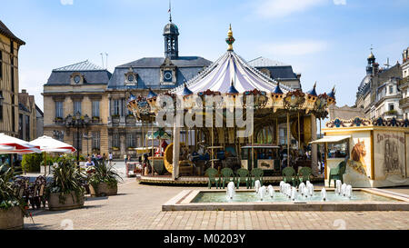TROYES, FRANCE - JUNE 29, 2010: people and carousel on front of Town Hall on square Place Marechal Foch in Troyes. Troyes city is the capital of Aube  Stock Photo