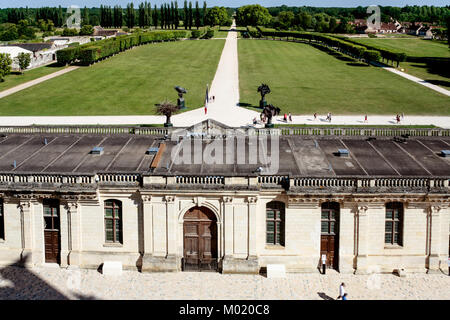 CHAMBORD, FRANCE - JULY 7, 2010: visitors in court and view of garden of castle Chateau de Chambord. Chambord is the largest chateau in the Loire Vall