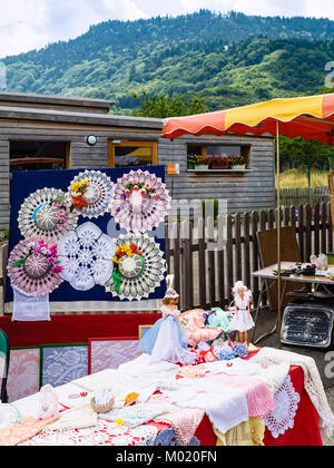 THANNENKIRCH, FRANCE - JULY 11, 2010: stall with needleworks on traditional flea market in Thannenkirch village in summer. Thannenkirch is commune in  Stock Photo